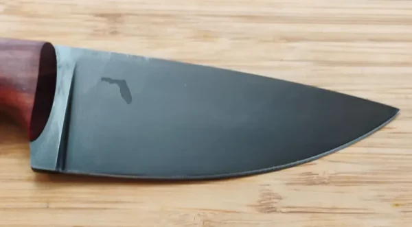 Right side of coffee etched blade showing Florida logo on custom camping knife with mild steel pins.
