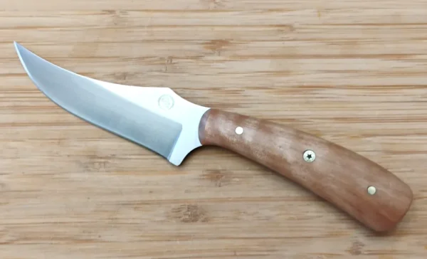 Left view of 7 1/2" Trailing Point knife, high carbon steel, black olive wood handle with mosaic pin.