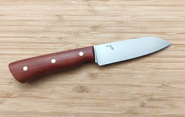 Red Cedar Paring Knife #347 knife with brushed 1095 steel blade on a wooden surface.