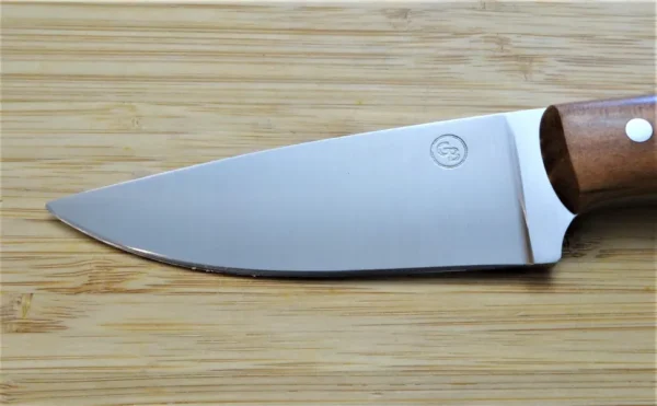 Close-up of the Wild Black Cherry Goldilocks #211 knife blade, left view, featuring a 3 3/4-inch 1095 high carbon steel drop point design.
