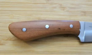 Close-up of the right side of stabilized Wild Blalck Cherry wood and mild steel pins