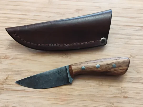 Full left view of drop point knife and custom sheath with belt clip sheath