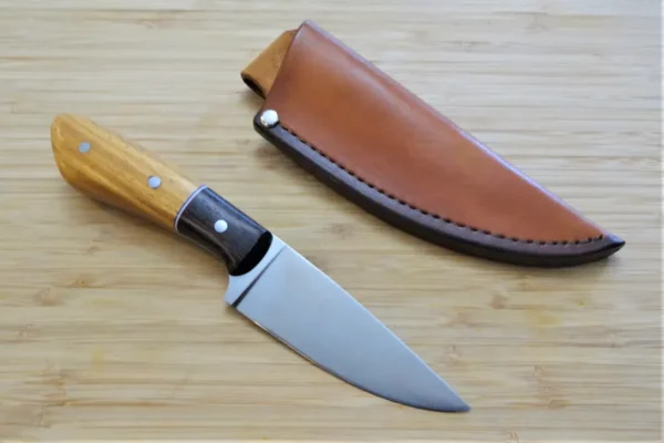 Exotic Osage Orange & Wenge Goldilocks Knife next to its custom hand-cut and dyed leather pouch sheath