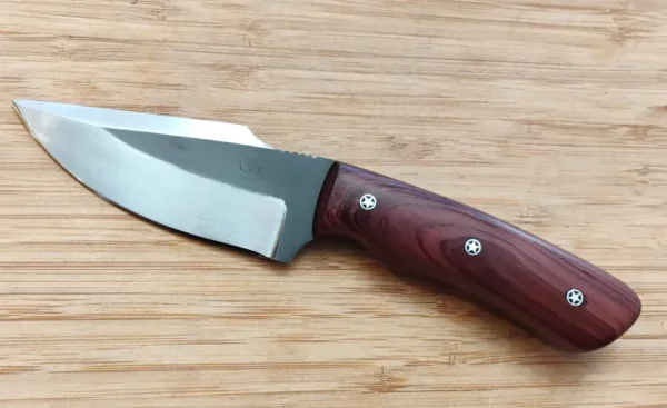 Left view of the Red Cedar Chubby #353 knife -a two-toned harpoon clip point blade, stabilized wood handle and mosaic pins.
