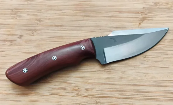 Right side view of the Red Cedar Chubby #353 custom knife - its two-toned blade and figured red cedar