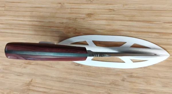Belly view of the Red Cedar Chubby #353 custom knife highlighting thumb serrations and 2 7/8-inch swedge
