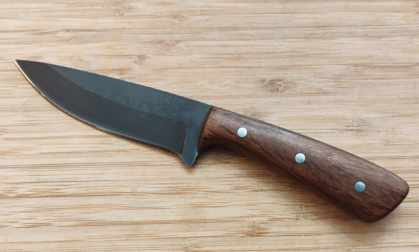 Left side view of the Devon hunting knife with a stabilized Live Oak handle and coffee-etched 1095 high carbon steel blade.